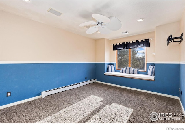 empty room with carpet floors, a baseboard radiator, visible vents, and ceiling fan