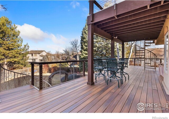 wooden deck with outdoor dining area