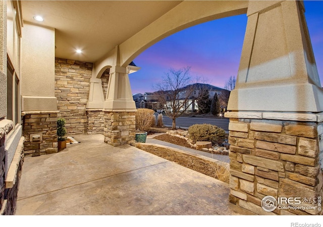 view of patio terrace at dusk