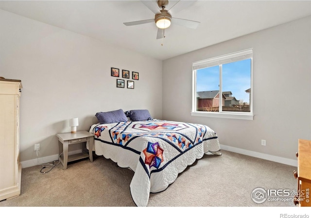 bedroom with light carpet, ceiling fan, and baseboards