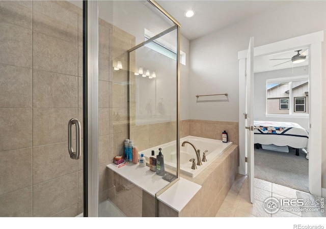 ensuite bathroom featuring a ceiling fan, a stall shower, ensuite bath, a bath, and tile patterned floors