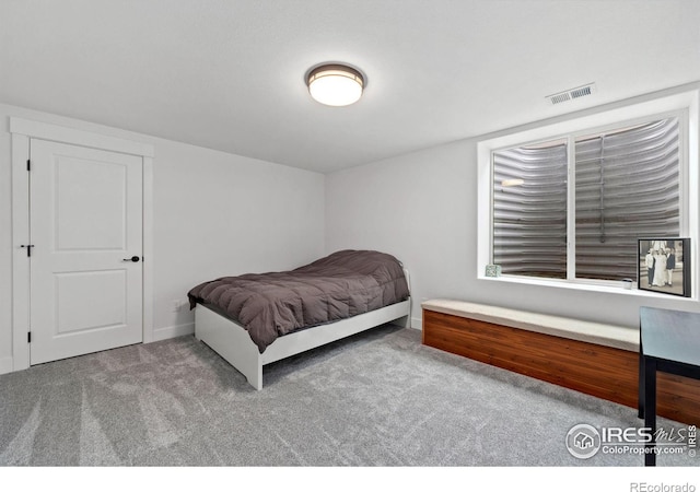 bedroom featuring carpet flooring and visible vents