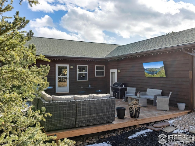 rear view of property with a shingled roof, outdoor lounge area, and a wooden deck