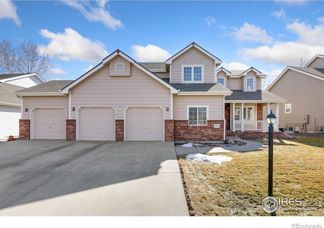 view of front of home with a porch, an attached garage, brick siding, concrete driveway, and a front yard