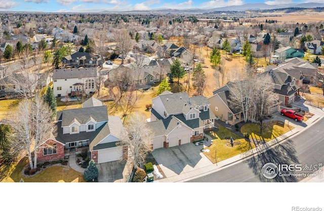 birds eye view of property with a residential view