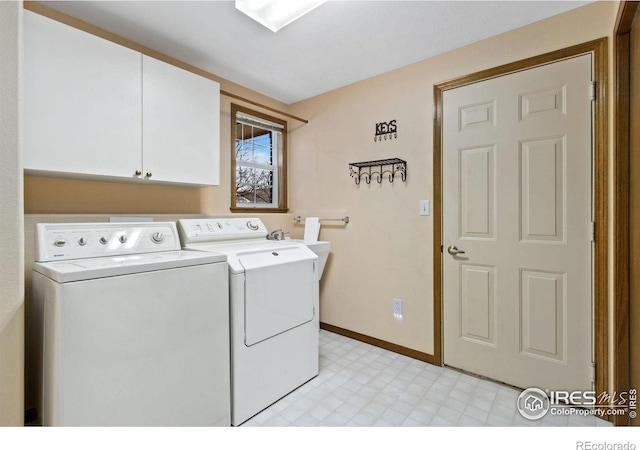 laundry area with light floors, cabinet space, independent washer and dryer, and baseboards