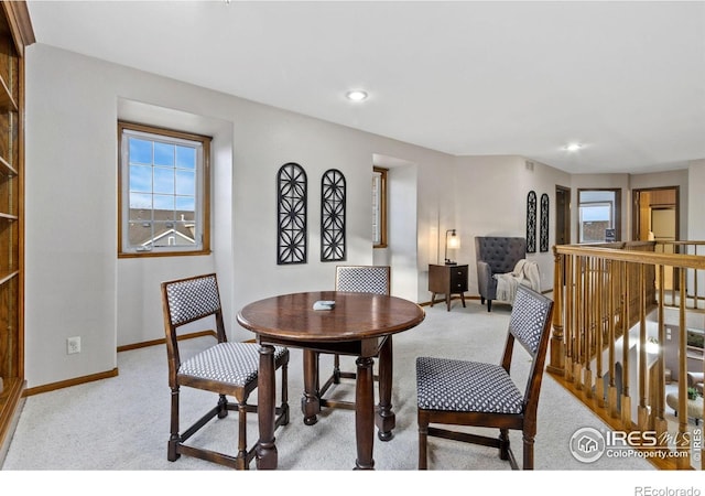 dining room featuring recessed lighting, light carpet, visible vents, and baseboards