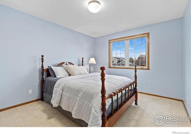 carpeted bedroom with baseboards