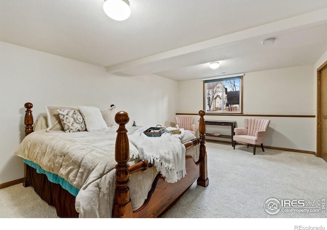 bedroom with carpet floors and baseboards