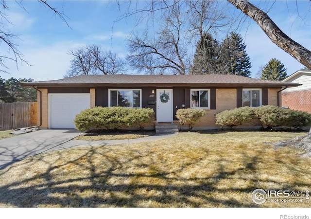 ranch-style home with a garage, brick siding, fence, concrete driveway, and a front yard