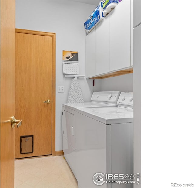 clothes washing area featuring washer and dryer, cabinet space, and light floors