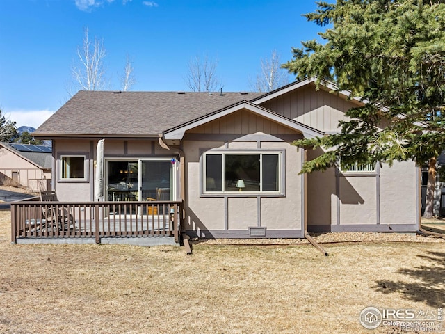 view of front of home with a shingled roof and stucco siding