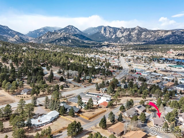 birds eye view of property with a mountain view