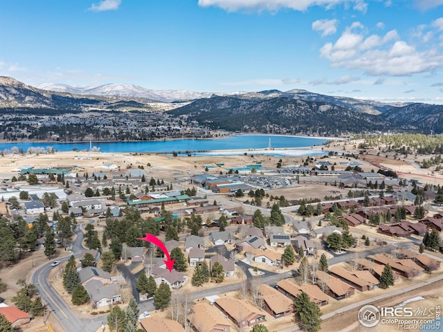 bird's eye view with a residential view and a water and mountain view