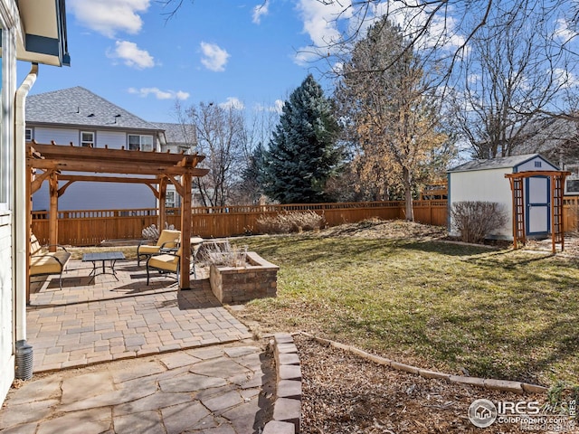 view of yard featuring a fenced backyard, an outdoor structure, and a patio