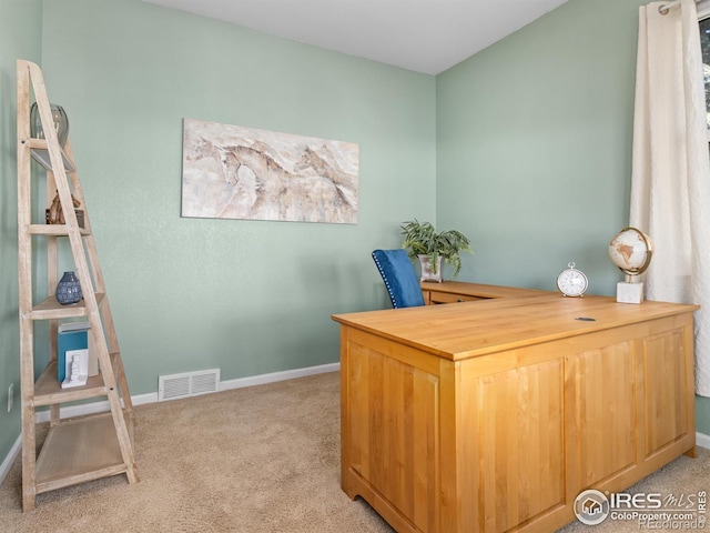 office area featuring carpet, visible vents, and baseboards