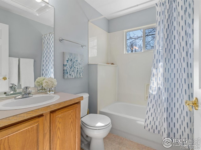 bathroom featuring toilet, shower / tub combo, and vanity