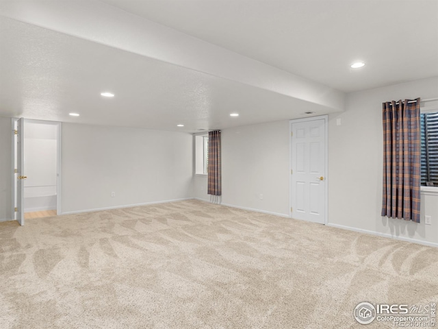 finished basement featuring baseboards, carpet flooring, and recessed lighting