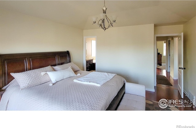 bedroom with baseboards, an inviting chandelier, and wood finished floors