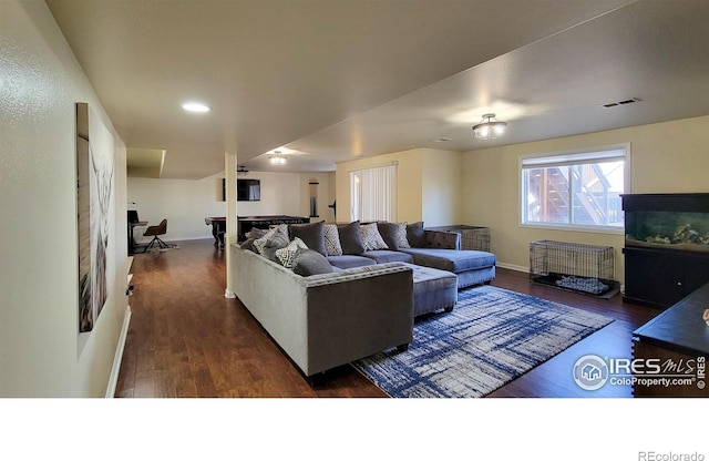 living area with visible vents, recessed lighting, baseboards, and wood finished floors