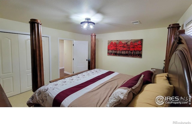 carpeted bedroom with visible vents