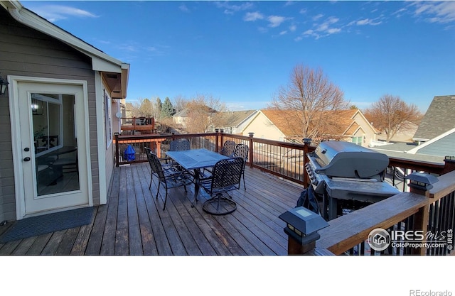 wooden deck featuring outdoor dining space