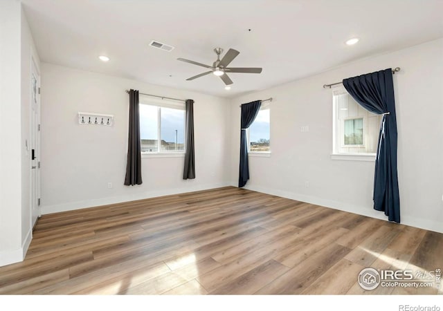 spare room featuring visible vents, baseboards, ceiling fan, recessed lighting, and light wood-style flooring