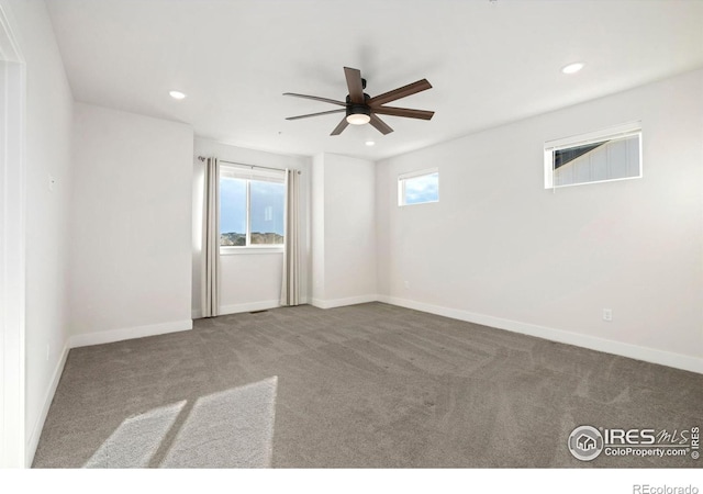 spare room featuring recessed lighting, carpet, and a ceiling fan