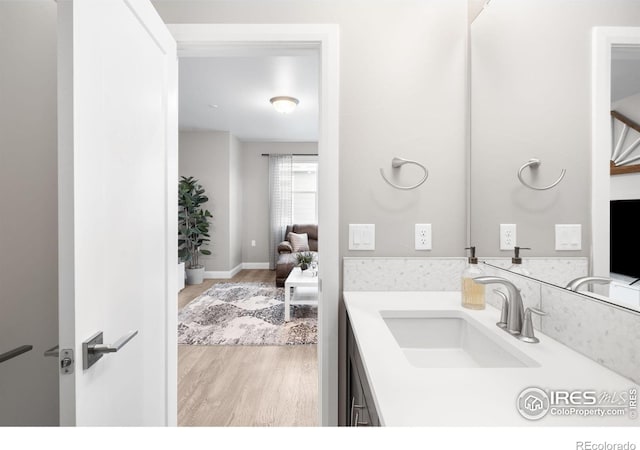 bathroom featuring vanity and wood finished floors