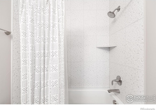 bathroom with shower / bathtub combination with curtain