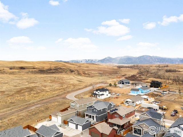 birds eye view of property with a residential view and a mountain view