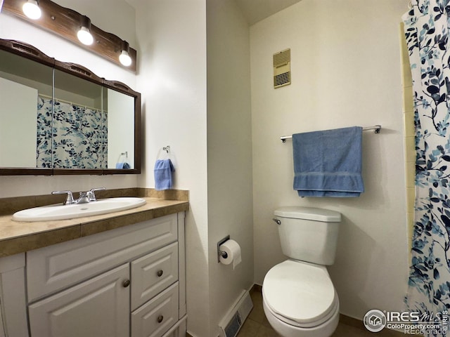 bathroom with toilet, baseboards, visible vents, and vanity