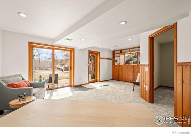 interior space with wainscoting, carpet, visible vents, and recessed lighting