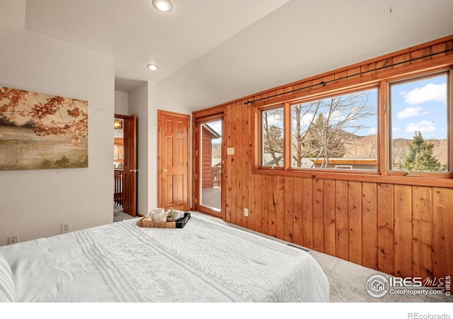 bedroom featuring recessed lighting, wooden walls, carpet flooring, vaulted ceiling, and access to outside