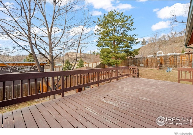 deck with a fenced backyard