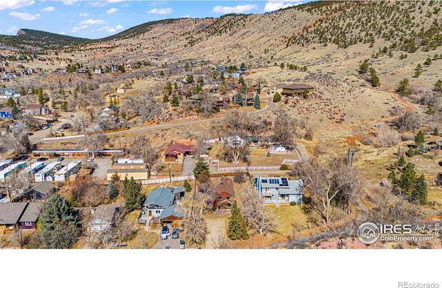 birds eye view of property with a residential view and a mountain view