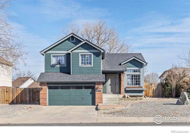 view of front of property featuring an attached garage, brick siding, fence, concrete driveway, and roof with shingles