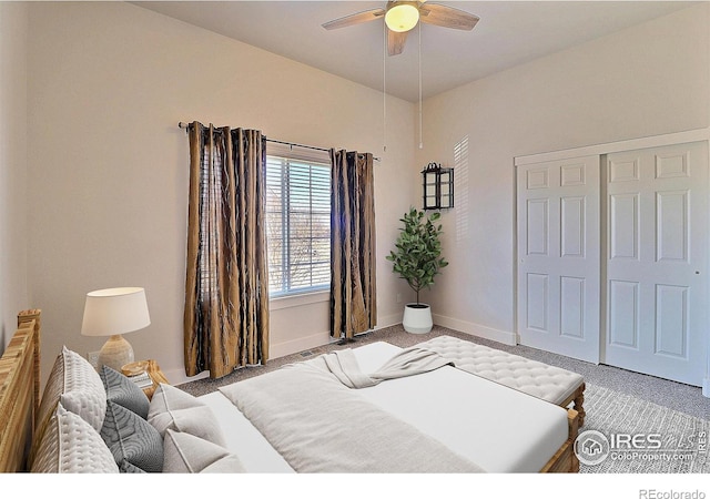 bedroom featuring a ceiling fan, a closet, light carpet, and baseboards