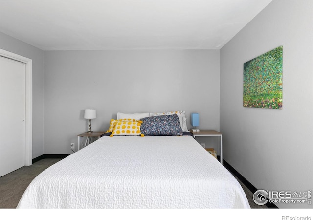 bedroom featuring carpet floors and baseboards