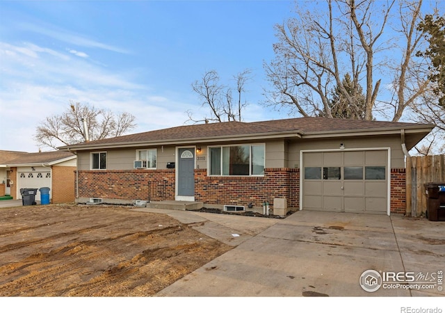 single story home with brick siding, driveway, an attached garage, and fence