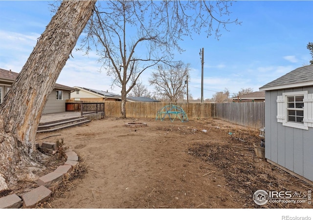 view of yard with an outdoor fire pit and a fenced backyard