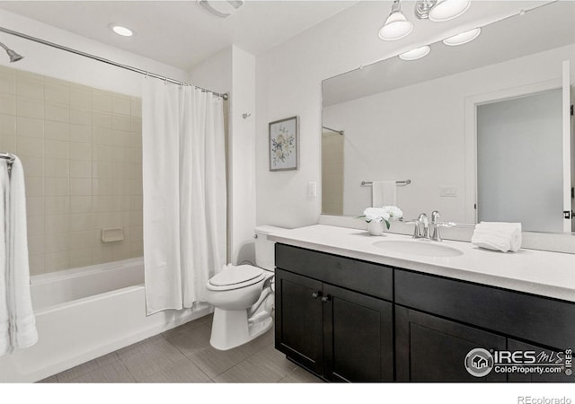 bathroom with tile patterned flooring, vanity, toilet, and shower / bath combo with shower curtain