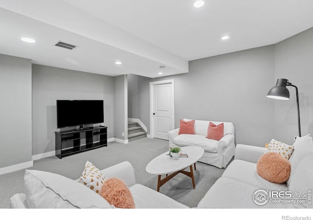 living area featuring visible vents, stairway, baseboards, and recessed lighting