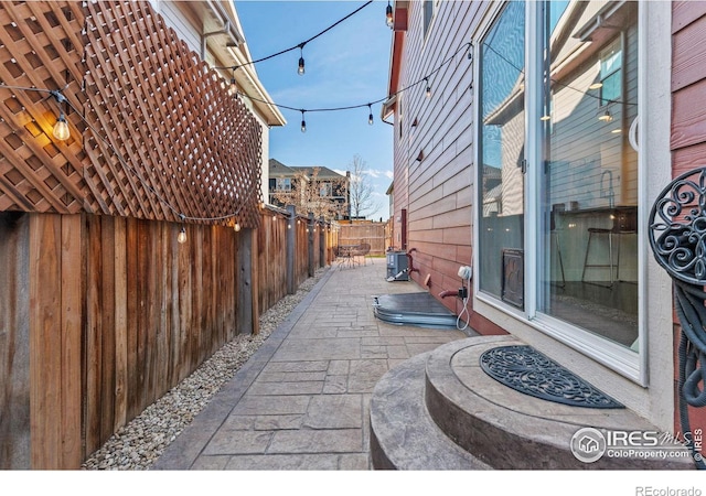 view of patio featuring a fenced backyard and central AC unit