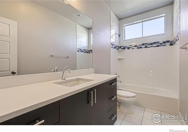 bathroom featuring vanity, shower / bath combination, tile patterned flooring, and toilet