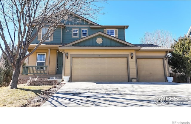 view of front of property with an attached garage, board and batten siding, and concrete driveway