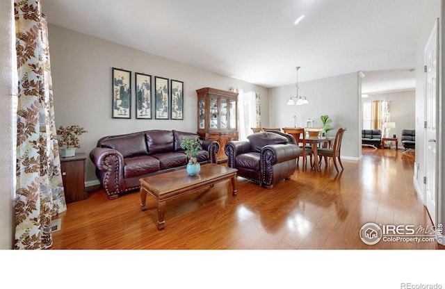 7145 Brittany Dr, Fort Collins, CO 80525 - living area featuring wood finished floors and baseboards