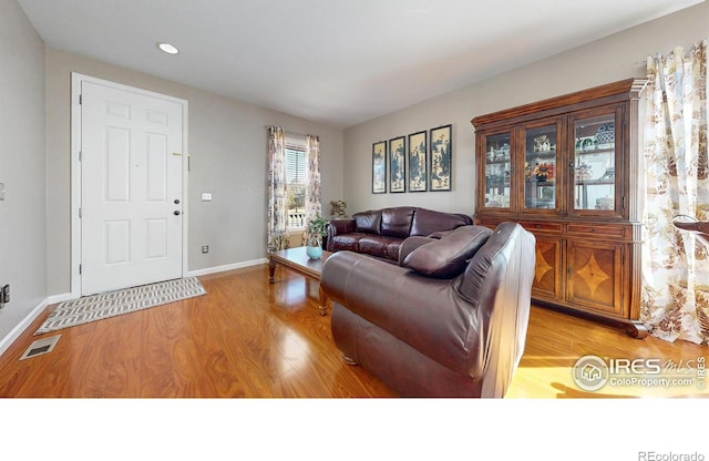 7145 Brittany Dr, Fort Collins, CO 80525 - living area featuring light wood-style flooring, recessed lighting, and baseboards