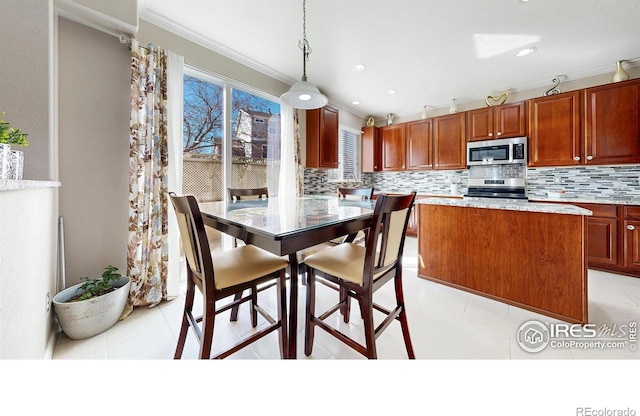 7145 Brittany Dr, Fort Collins, CO 80525 - dining room featuring crown molding and recessed lighting