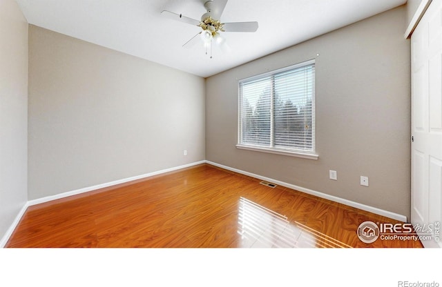 7145 Brittany Dr, Fort Collins, CO 80525 - empty room featuring wood finished floors, baseboards, and a ceiling fan